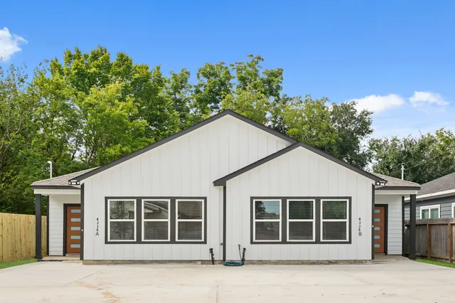 a view of a house with a tree