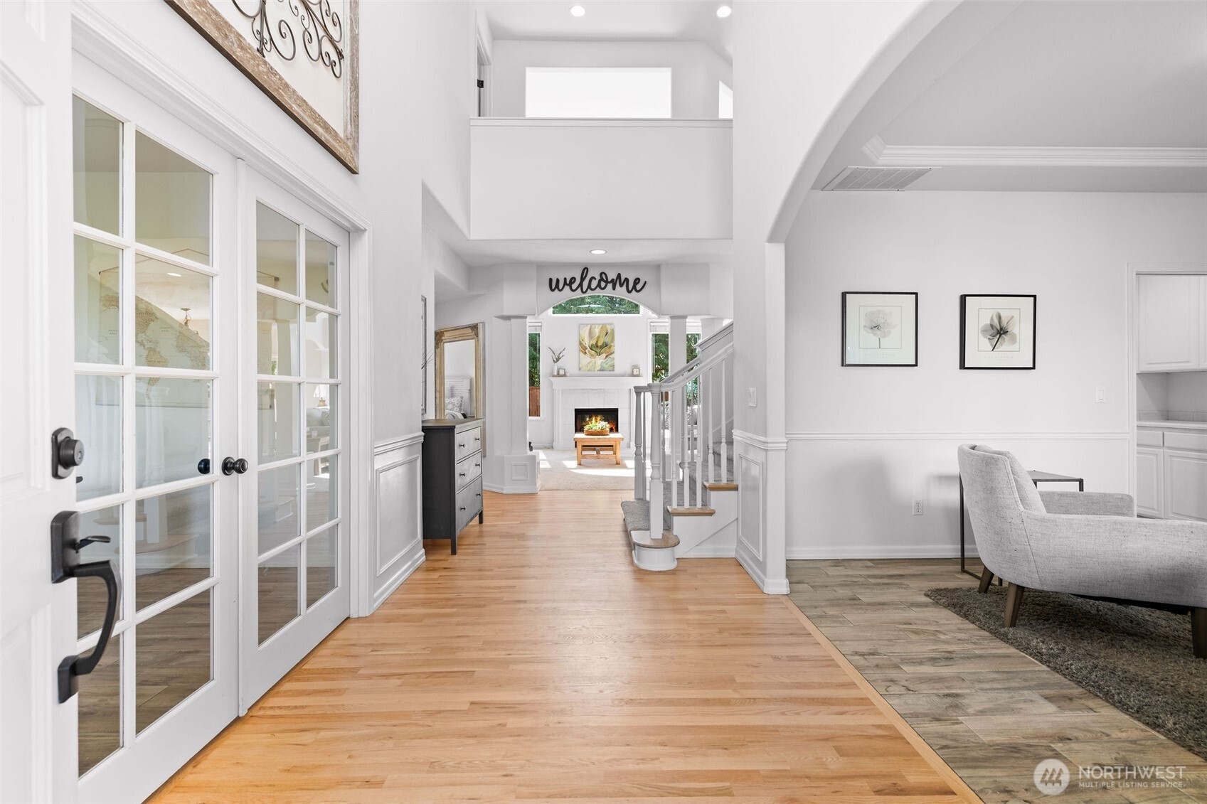 8425 Smugglers Cove Lane Mukilteo, WA 98275 - Photo 5 of 40 a hallway with furniture and wooden floor