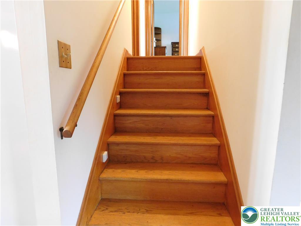 21 Will Barnesville, PA 18214 - Photo 15 of 23 Smooth wooden stairs with a matching banister provide access to the upper level.