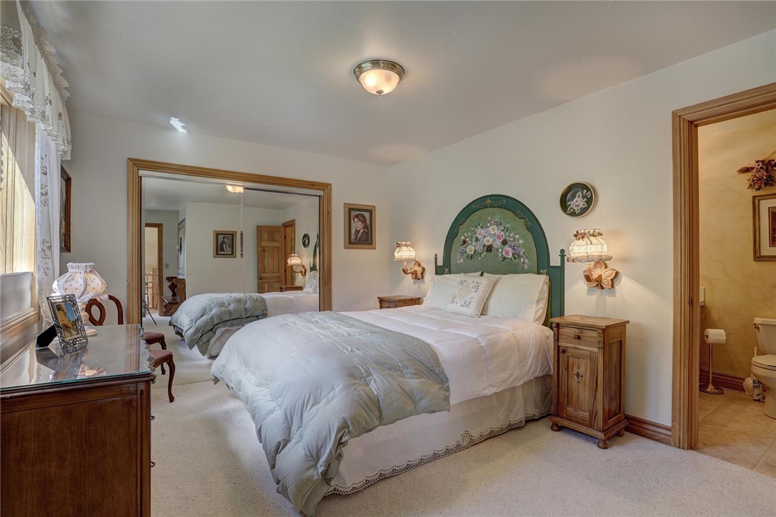 137 Rasor Drive Keystone, CO 80435 - Photo 14 of 35 a bedroom with a bed and a mirror on dresser