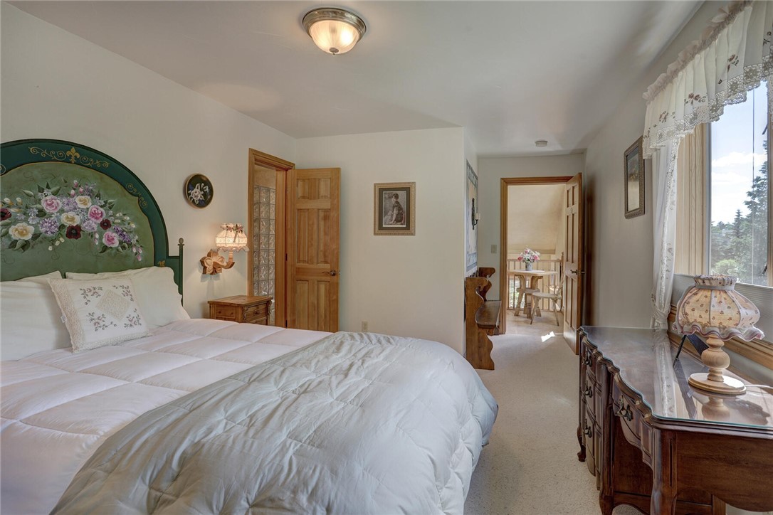 137 Rasor Drive Keystone, CO 80435 - Photo 15 of 35 a bedroom with a bed and wooden floor