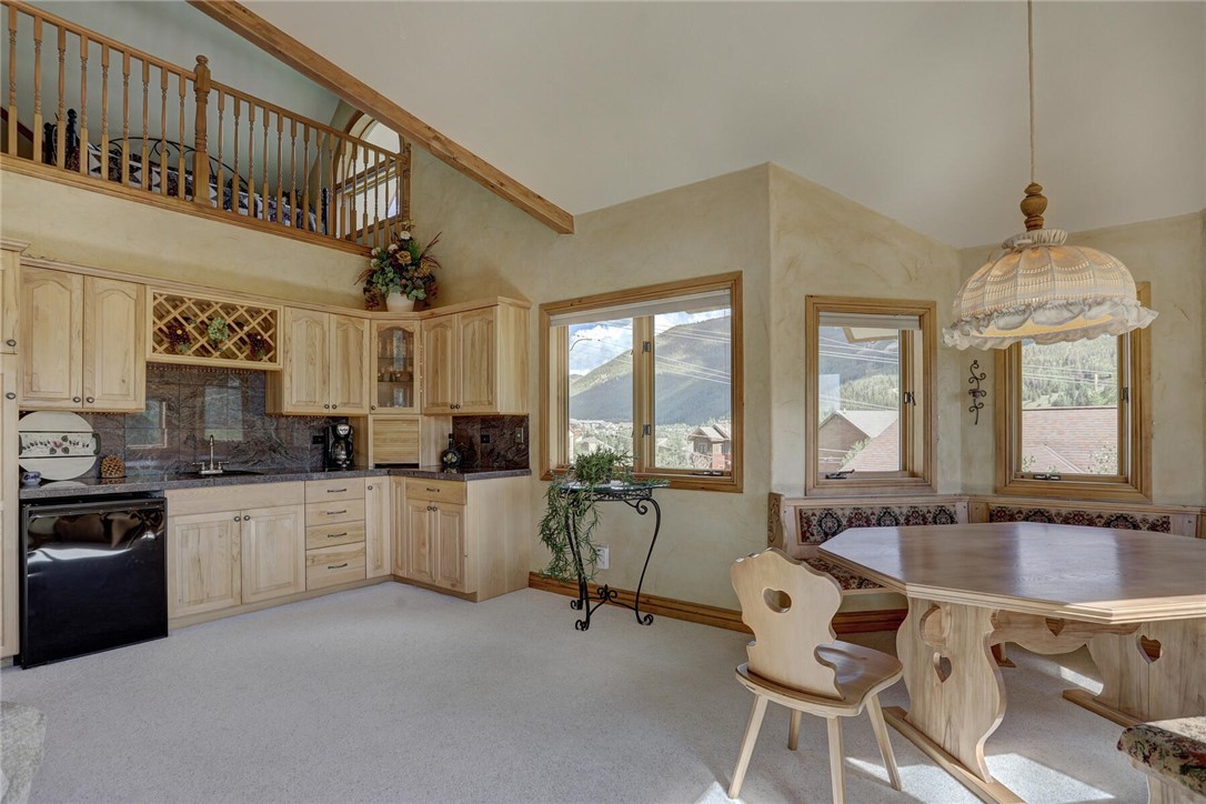 137 Rasor Drive Keystone, CO 80435 - Photo 19 of 35 a kitchen with sink cabinets and dining table
