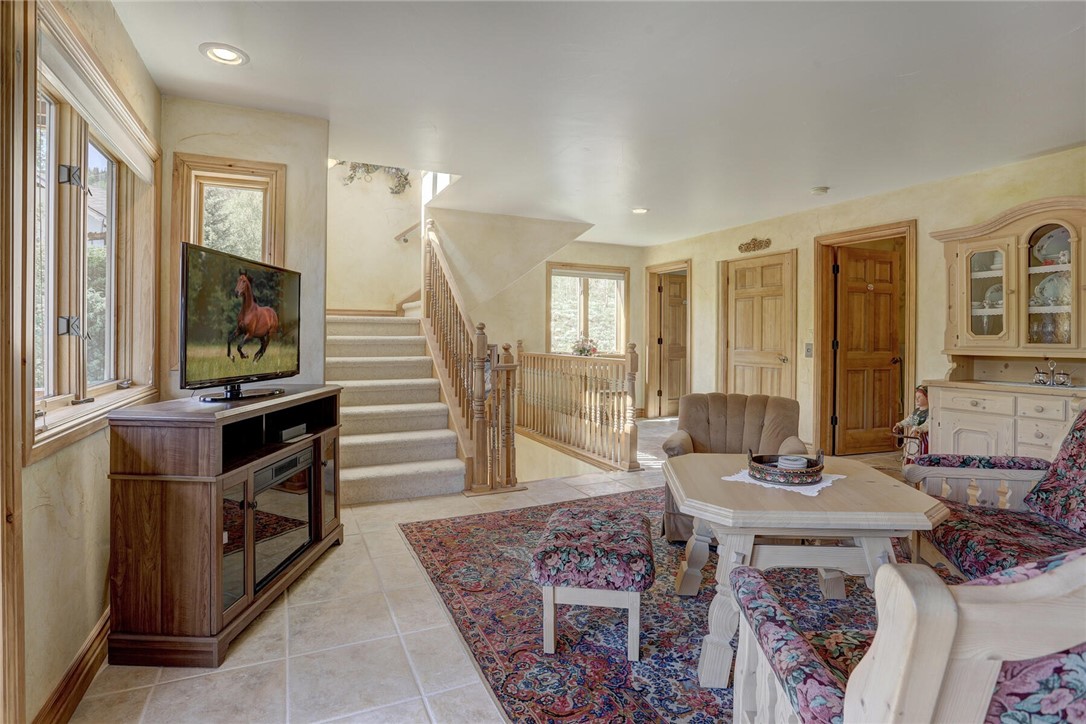 137 Rasor Drive Keystone, CO 80435 - Photo 6 of 35 a living room with furniture a flat screen tv and a fireplace