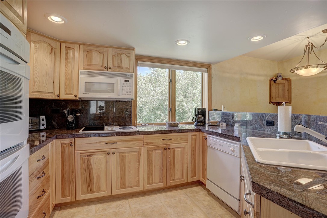 137 Rasor Drive Keystone, CO 80435 - Photo 9 of 35 a kitchen with a sink stove and cabinets