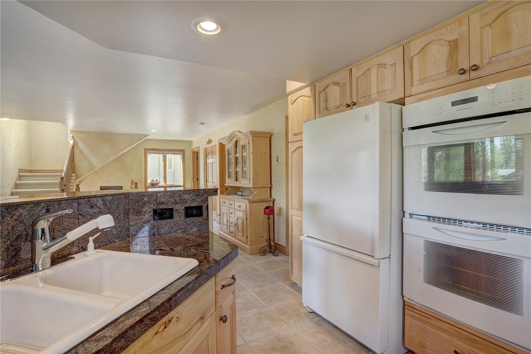 137 Rasor Drive Keystone, CO 80435 - Photo 10 of 35 a kitchen with a refrigerator sink and stove