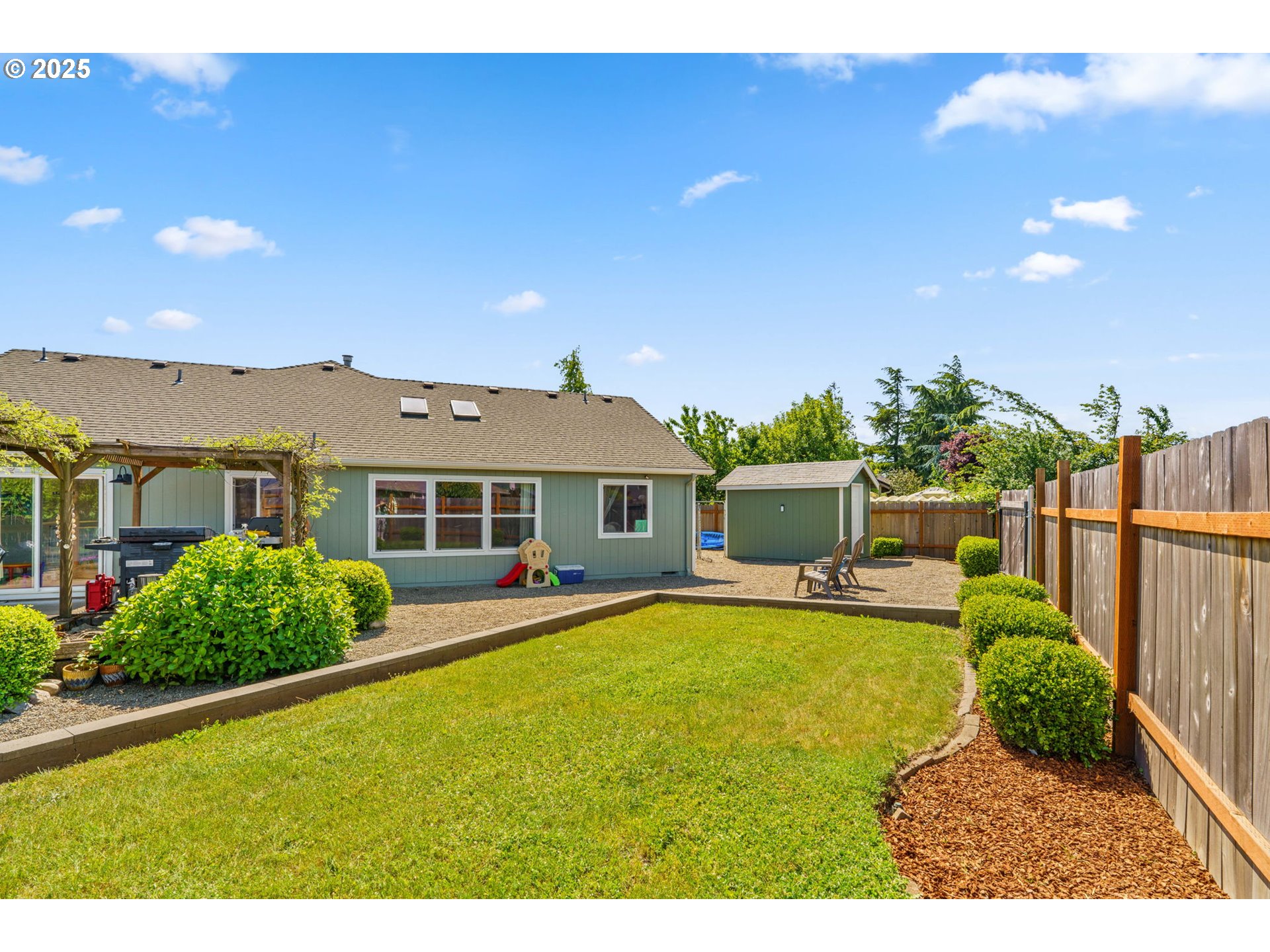 804 T Street Springfield, OR 97477 - Photo 31 of 45 a view of a house with a yard and potted plants