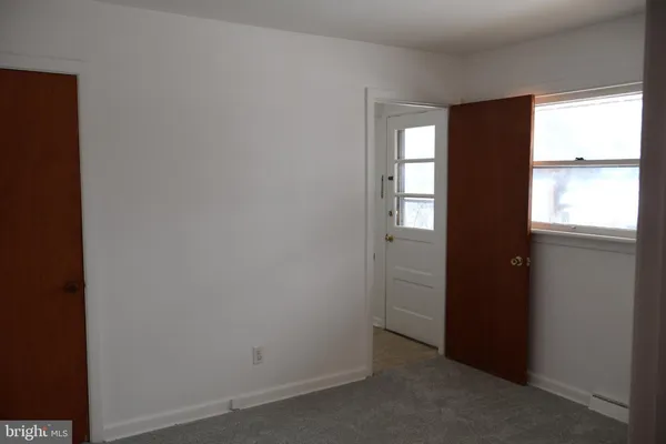 a bathroom with a toilet and a bathtub