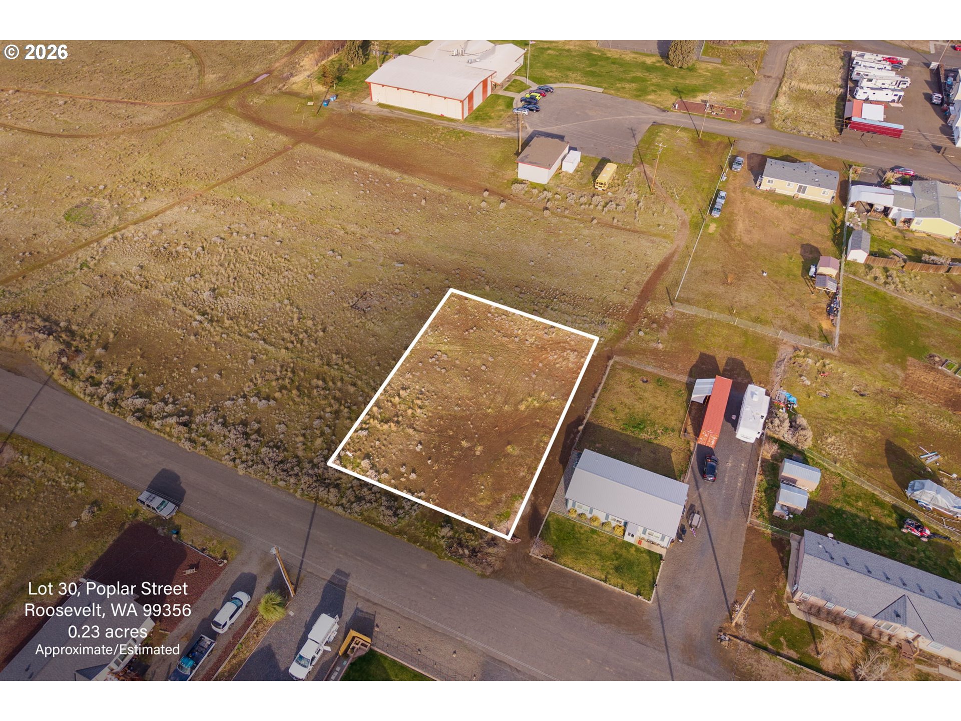 Poplar Street, Unit 30 Roosevelt, WA 99356 - Photo 5 of 13 aerial view of a house with a yard