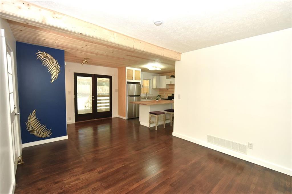2030 Sanders Drive Austell, GA 30168 - Photo 11 of 42 a view of an empty room with wooden floor and a window