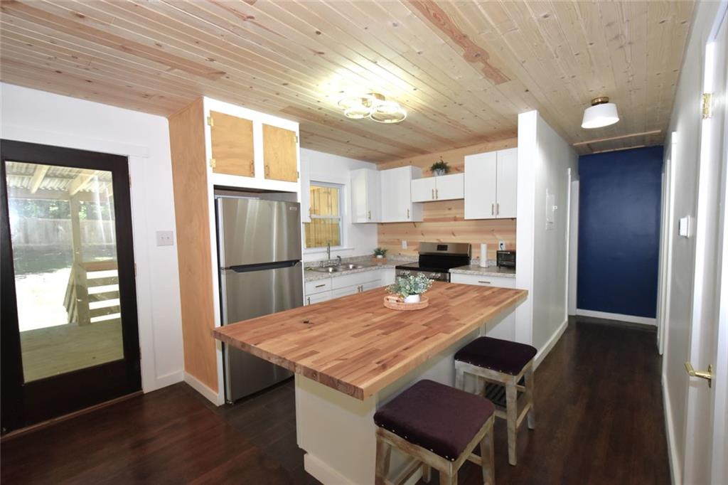 2030 Sanders Drive Austell, GA 30168 - Photo 12 of 42 a kitchen with a table and chairs in it