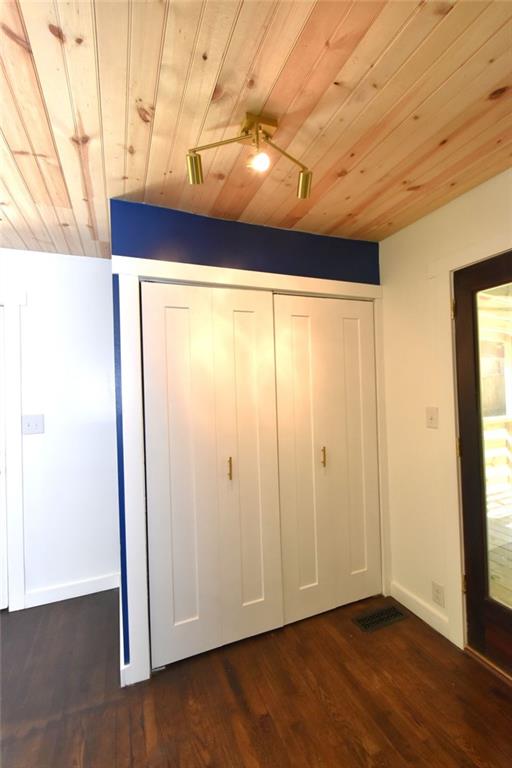 2030 Sanders Drive Austell, GA 30168 - Photo 15 of 42 a view of an empty room with wooden floor and a window