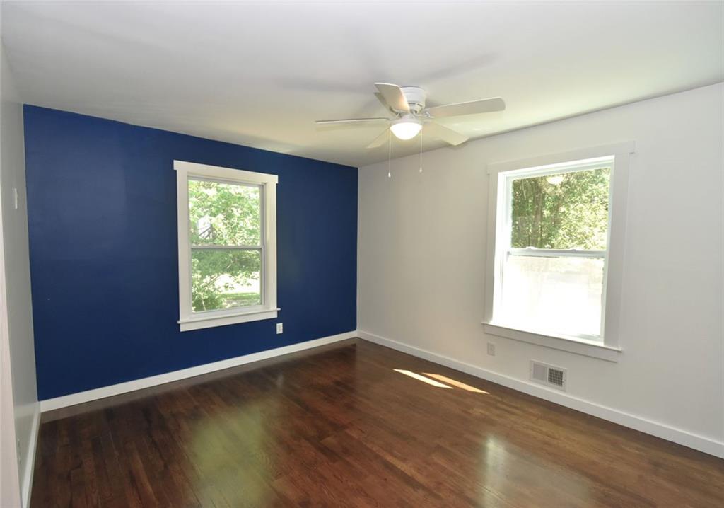 2030 Sanders Drive Austell, GA 30168 - Photo 18 of 42 a view of an empty room with wooden floor and a window