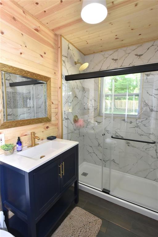 2030 Sanders Drive Austell, GA 30168 - Photo 19 of 42 a bathroom with a sink mirror and a bathtub