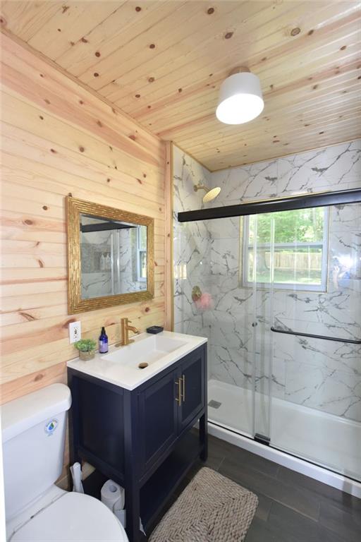 2030 Sanders Drive Austell, GA 30168 - Photo 21 of 42 a bathroom with a sink a toilet and shower