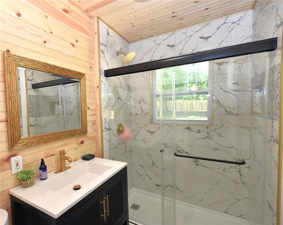 2030 Sanders Drive Austell, GA 30168 - Photo 22 of 42 a bathroom with a sink mirror and a shower