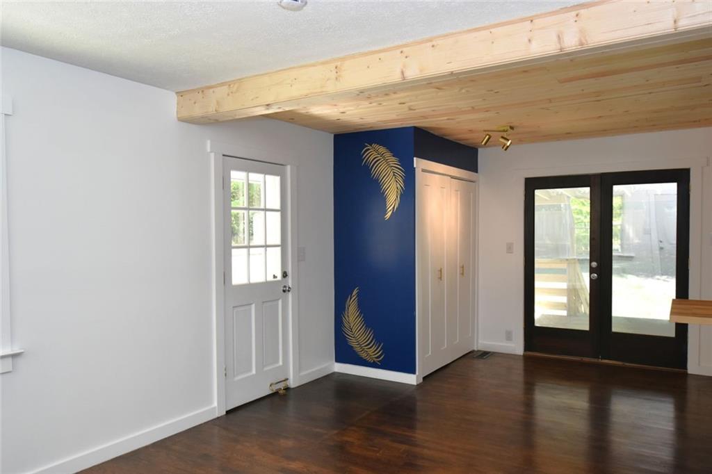 2030 Sanders Drive Austell, GA 30168 - Photo 3 of 42 a view of an empty room with wooden floor and a window