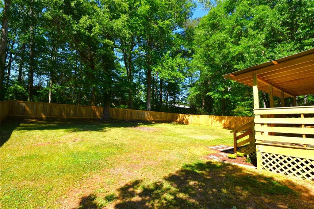 2030 Sanders Drive Austell, GA 30168 - Photo 36 of 42 a view of a swimming pool with a patio and a yard
