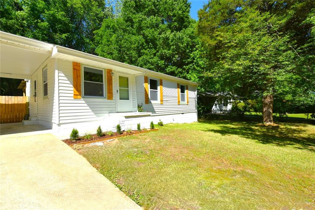 2030 Sanders Drive Austell, GA 30168 - Photo 40 of 42 a front view of a house with a yard