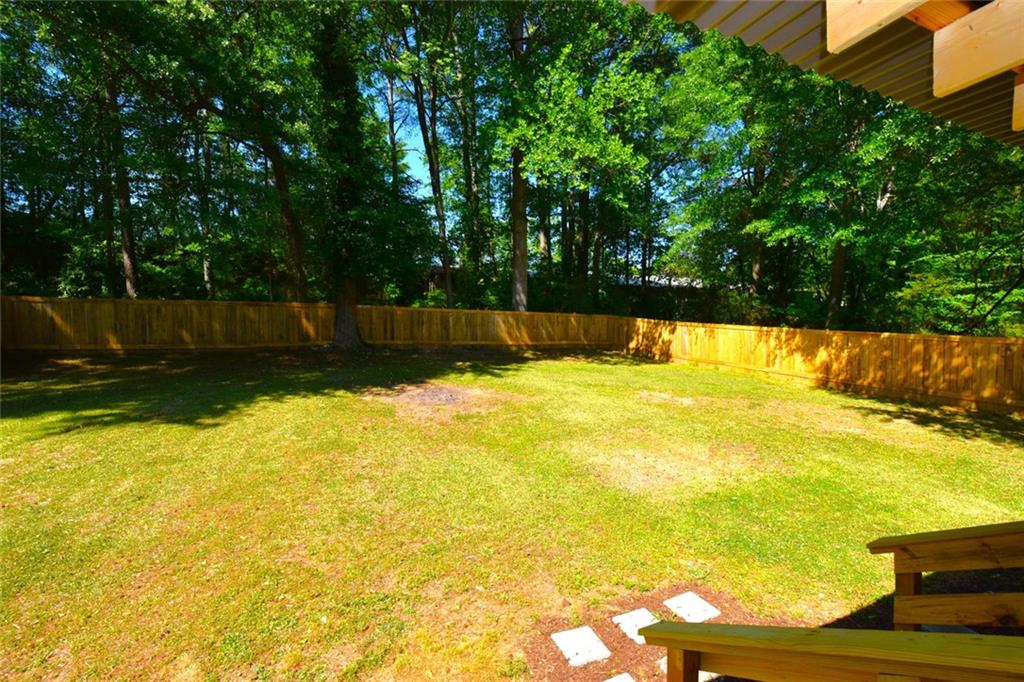 2030 Sanders Drive Austell, GA 30168 - Photo 42 of 42 a view of a swimming pool with an outdoor space and seating area