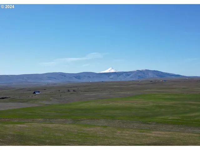 a view of an ocean and mountains
