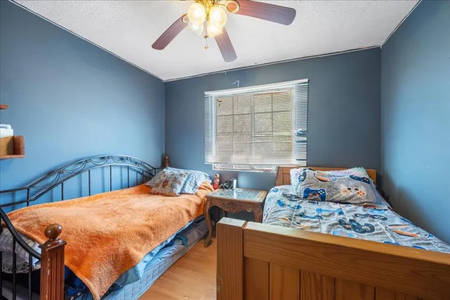 a bedroom with a bed and window