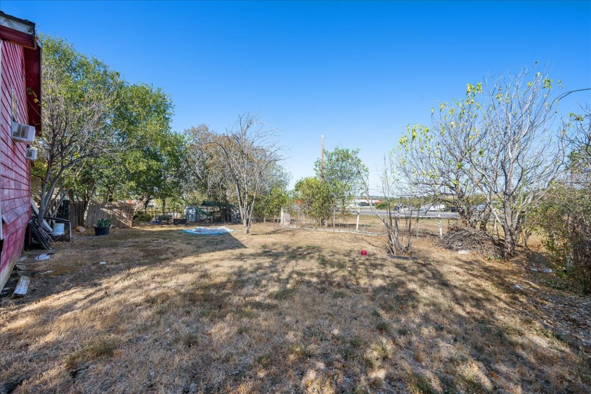 1107 Sturgis Street Taylor, TX 76574 - Photo 20 of 22 a backyard of a house with table and chairs