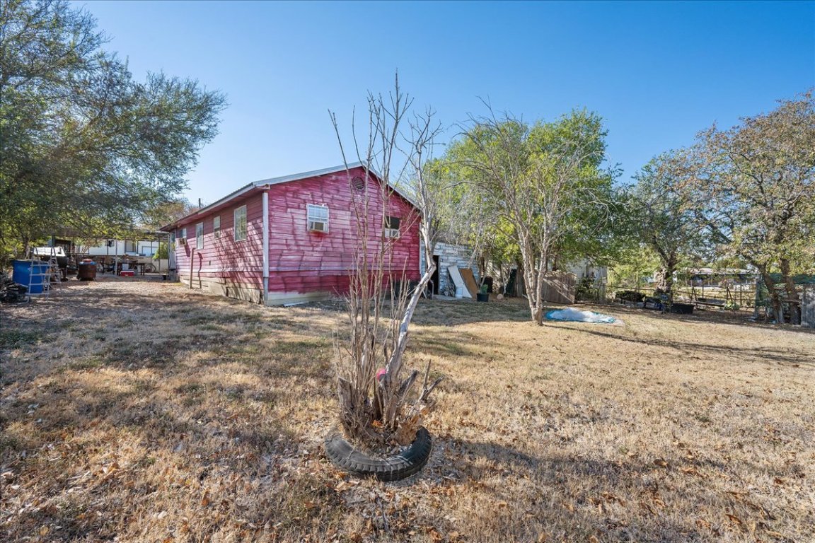 1107 Sturgis Street Taylor, TX 76574 - Photo 22 of 22 a view of a house with a yard