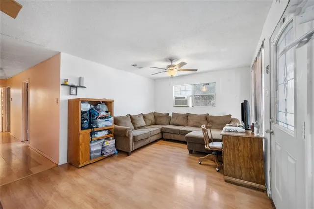a living room with furniture and a window