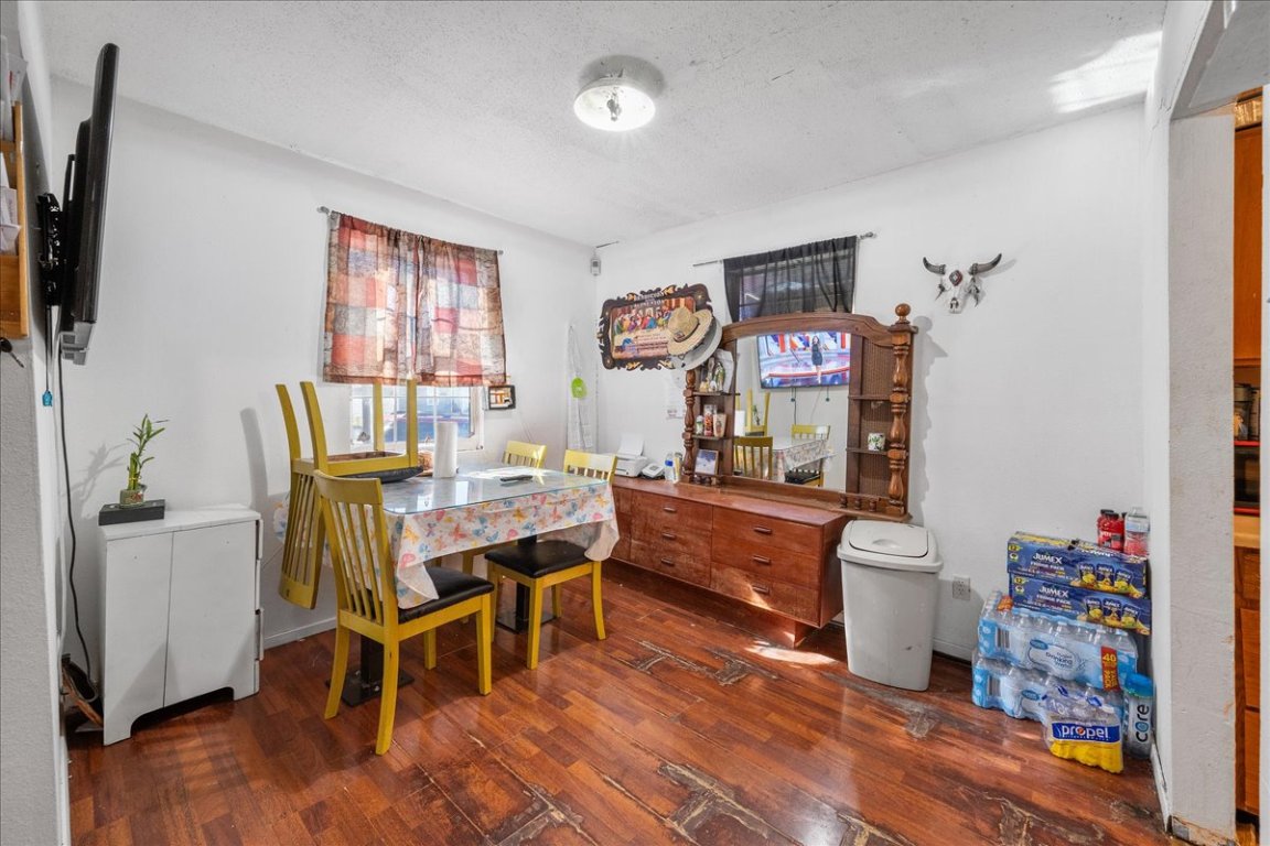 1107 Sturgis Street Taylor, TX 76574 - Photo 7 of 22 a view of a dining room with furniture window and wooden floor