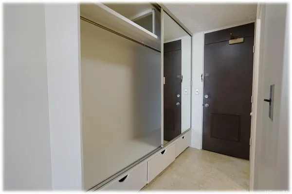 a bathroom with a granite countertop shower a toilet and a shower