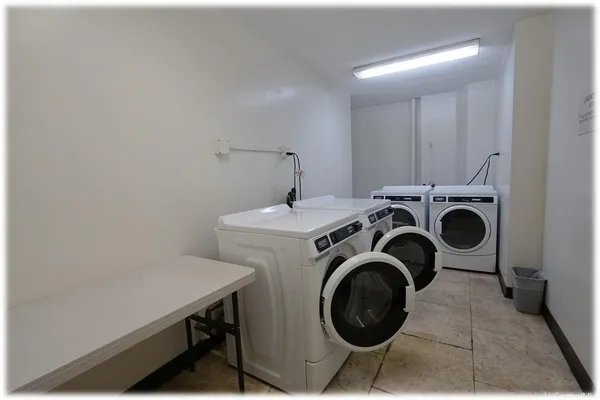 a view of roof deck with outdoor seating and city view