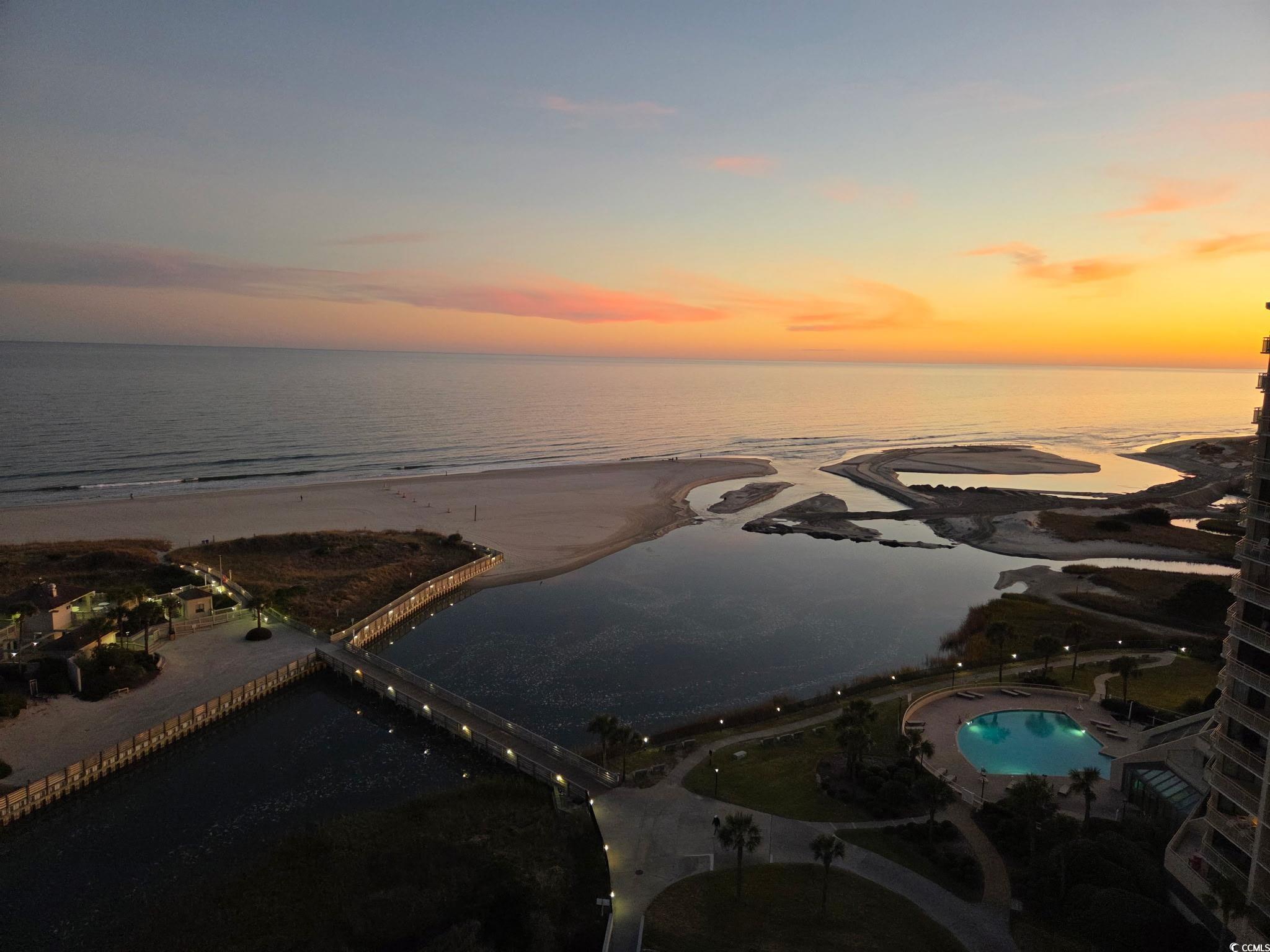100 Ocean Creek Drive, Unit G14 Myrtle Beach, SC 29572 - Photo 13 of 40 Aerial view of expansive beach and a pool
