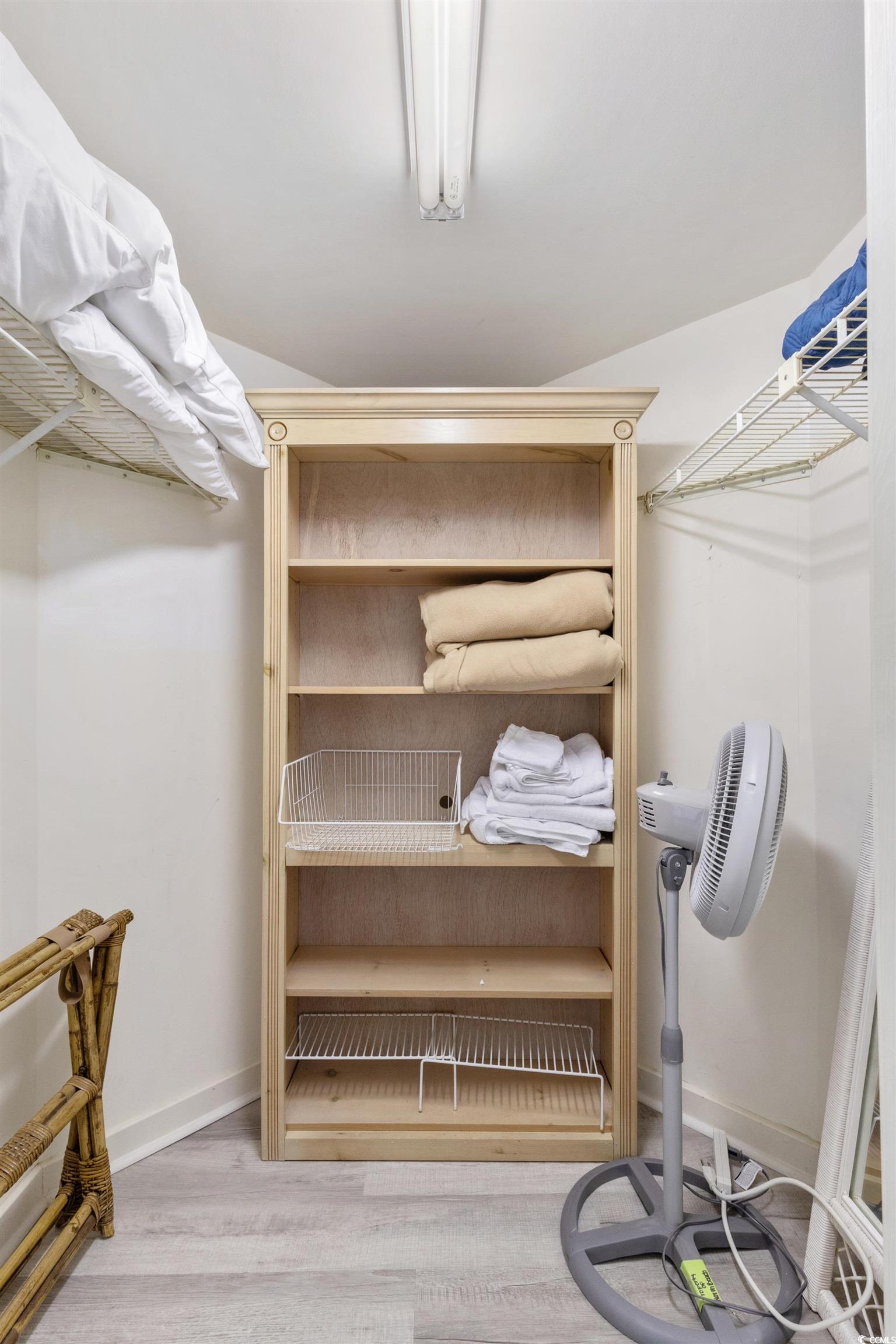 100 Ocean Creek Drive, Unit G14 Myrtle Beach, SC 29572 - Photo 26 of 40 Walk in closet with light wood-type flooring