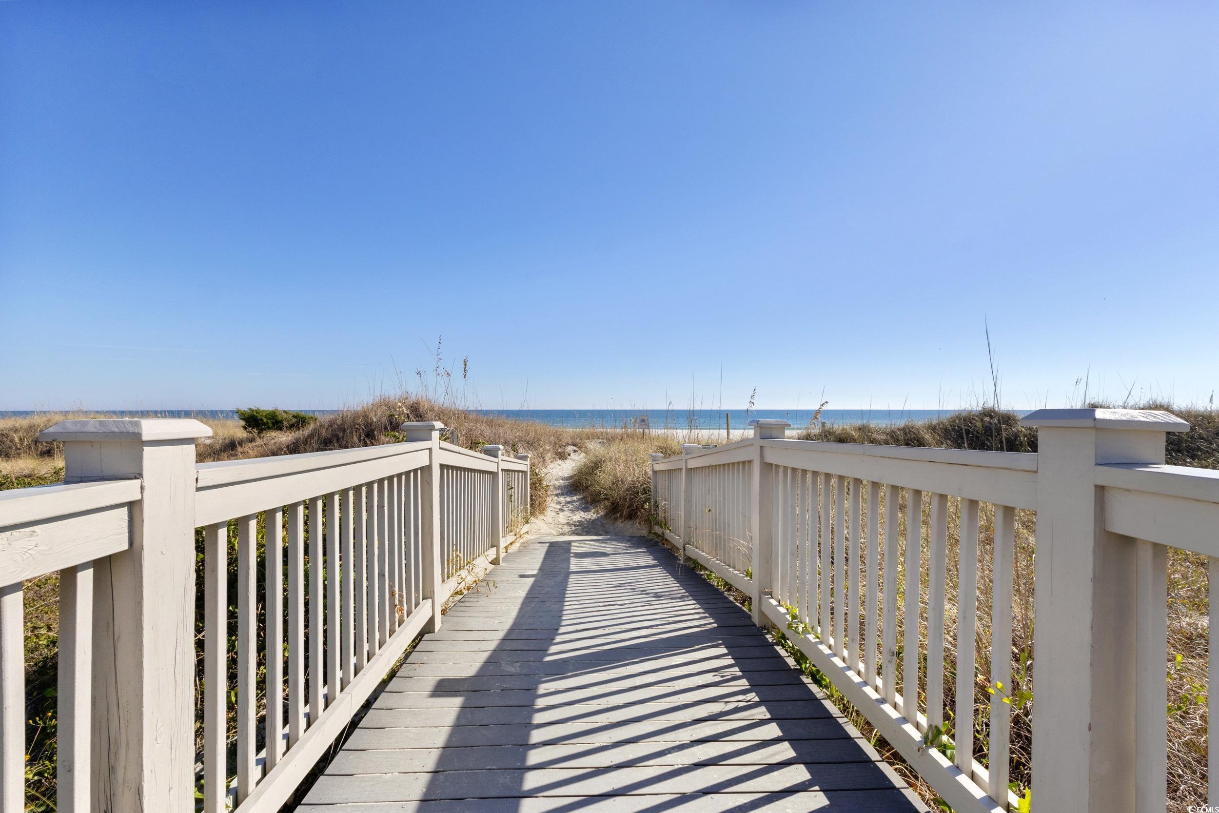 100 Ocean Creek Drive, Unit G14 Myrtle Beach, SC 29572 - Photo 28 of 40 View of property's community featuring view of local beach and a deck with water view