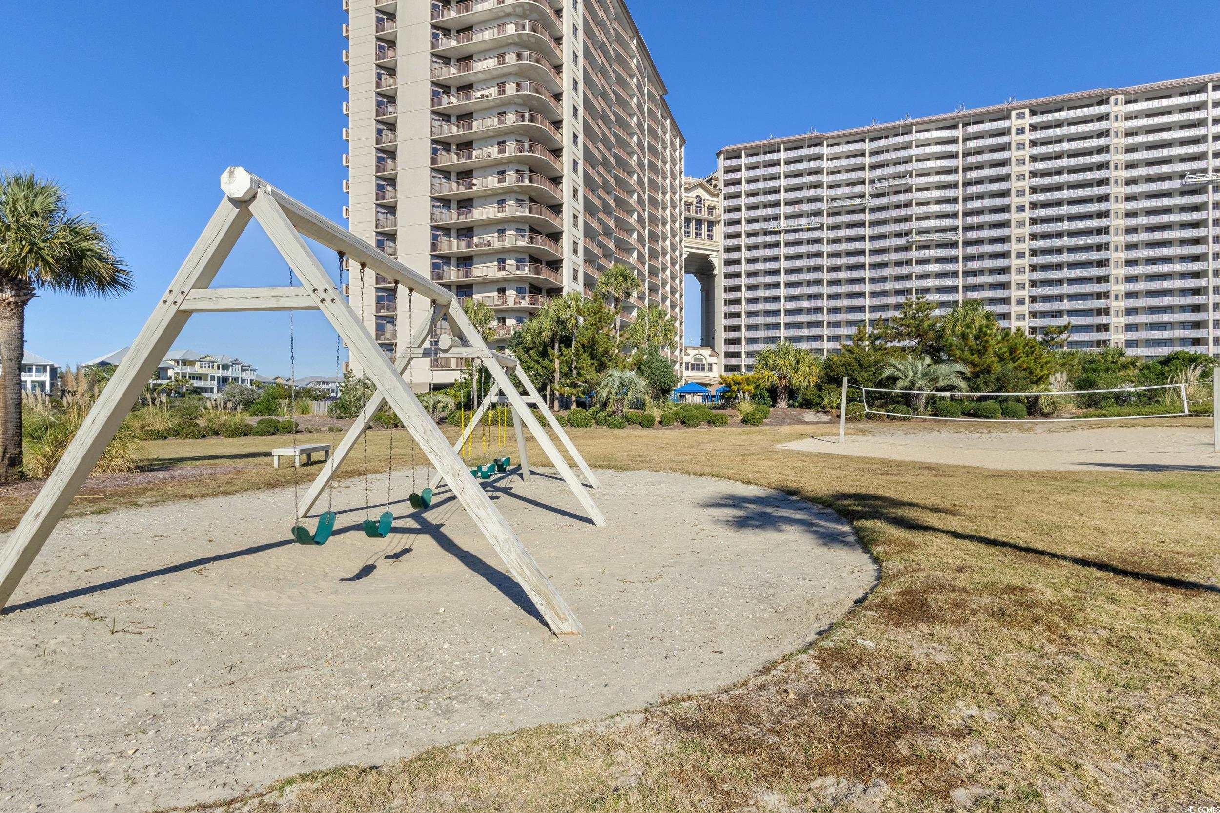 100 Ocean Creek Drive, Unit G14 Myrtle Beach, SC 29572 - Photo 33 of 40 Community playground featuring a yard