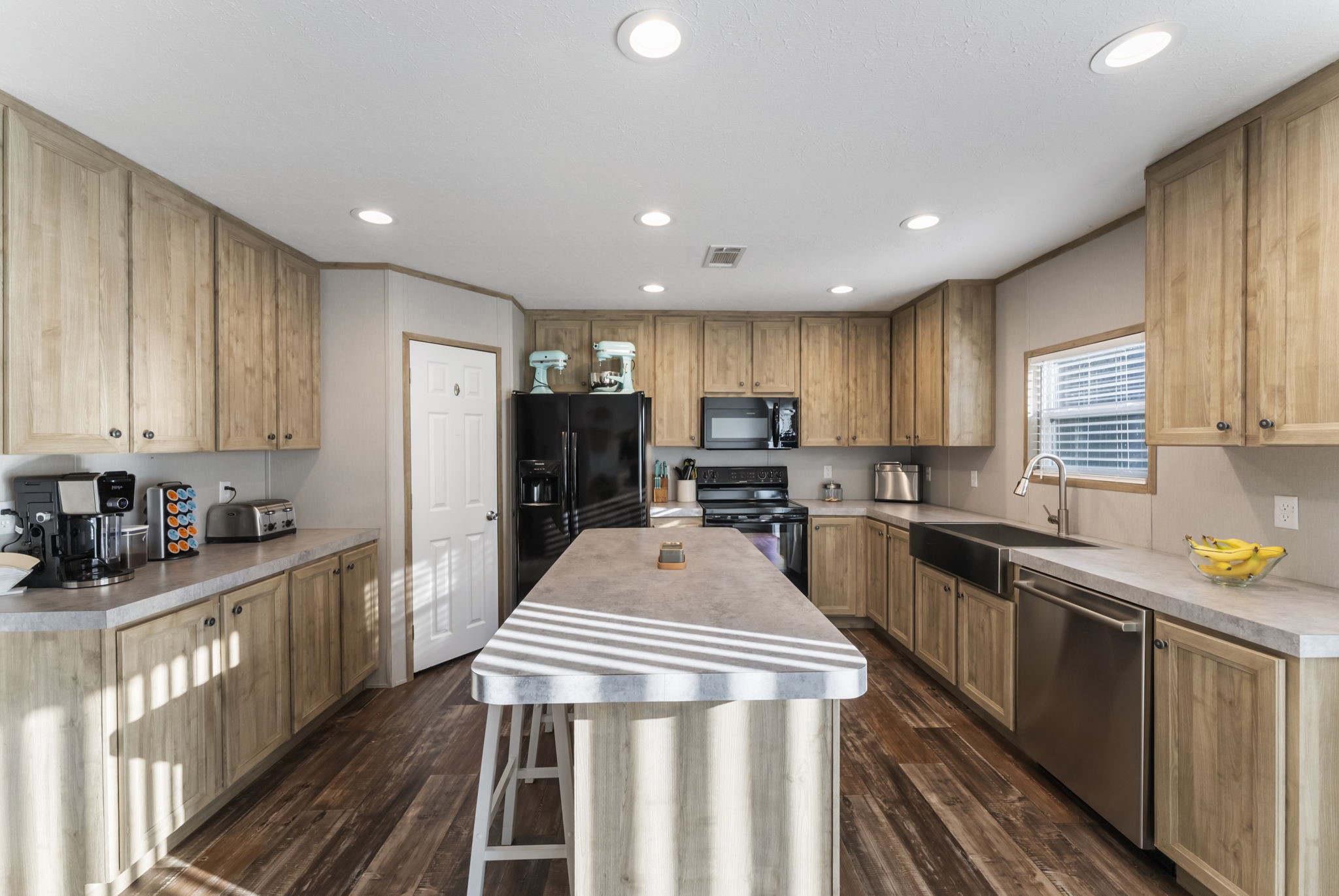 6913 Fm 3081 Road Willis, TX 77378 - Photo 13 of 46 a kitchen with sink cabinets and stainless steel appliances