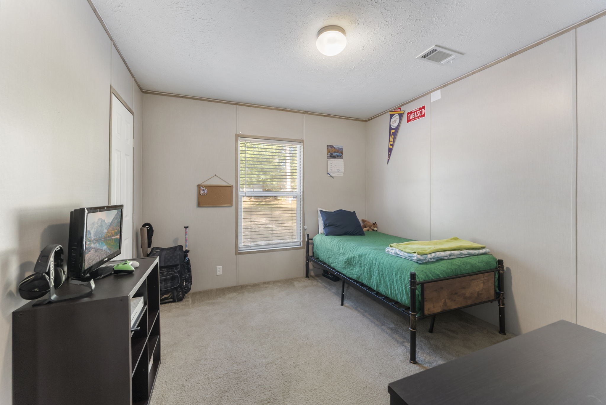 6913 Fm 3081 Road Willis, TX 77378 - Photo 18 of 46 a bedroom with furniture and a window