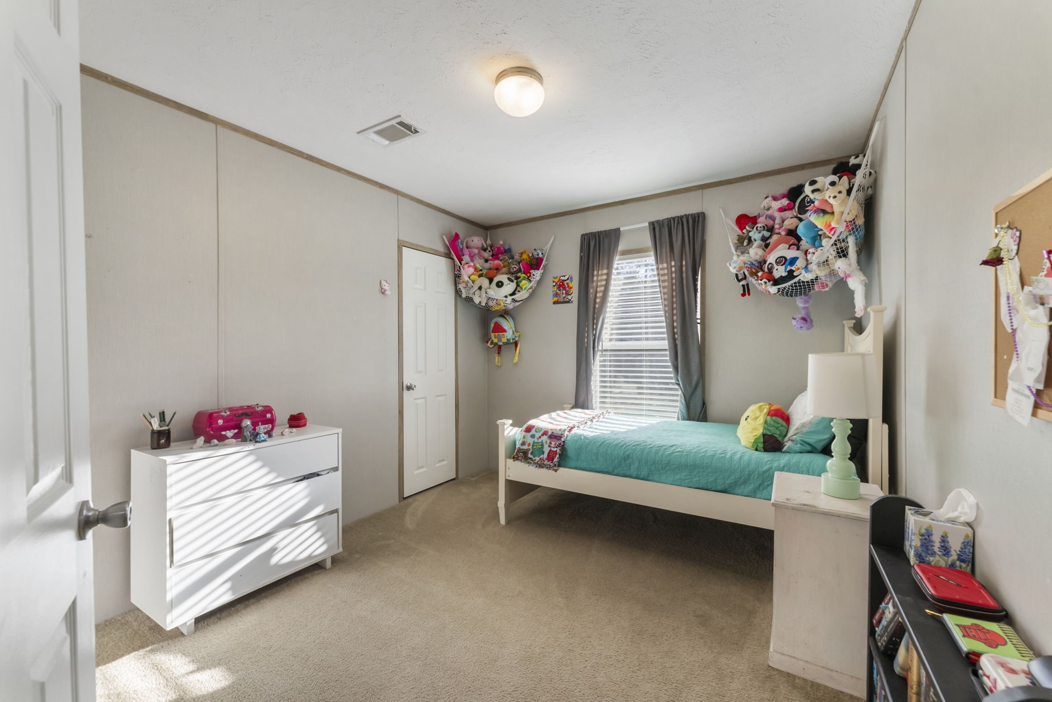 6913 Fm 3081 Road Willis, TX 77378 - Photo 19 of 46 a bedroom with furniture and a bed