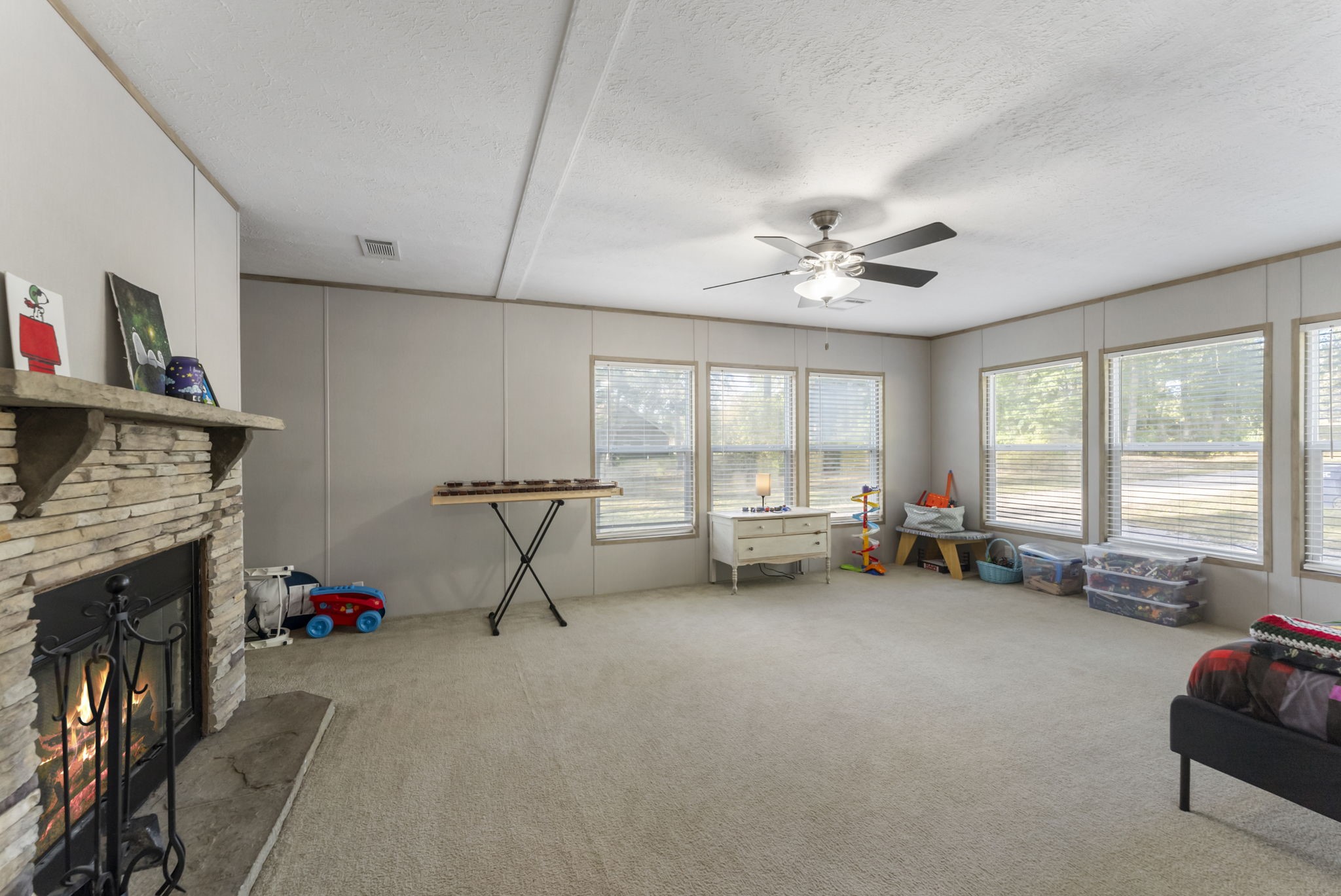 6913 Fm 3081 Road Willis, TX 77378 - Photo 22 of 46 a living room with furniture and a fireplace