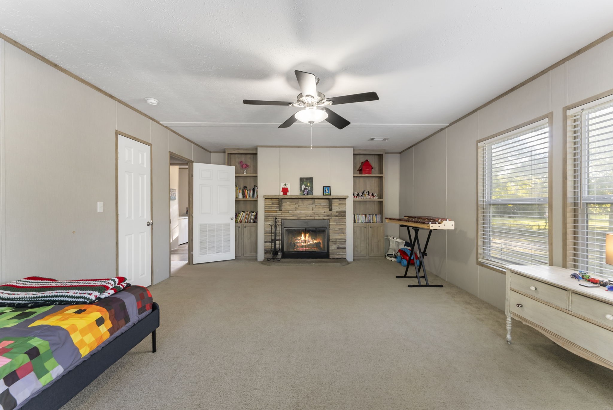 6913 Fm 3081 Road Willis, TX 77378 - Photo 23 of 46 a bedroom with furniture and a bed