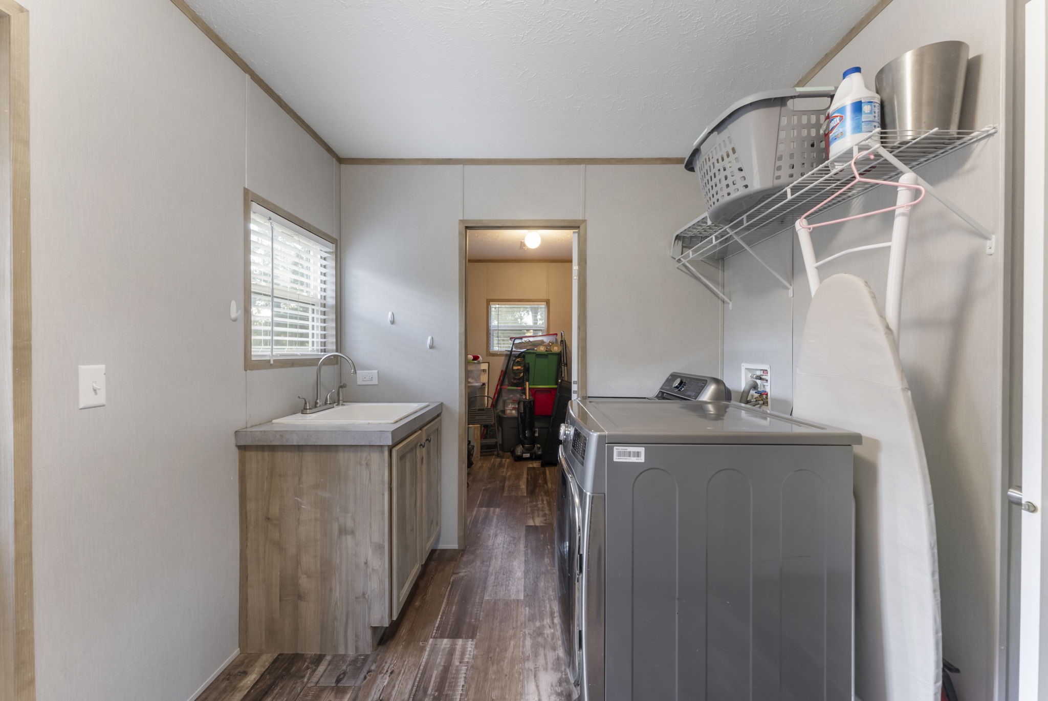 6913 Fm 3081 Road Willis, TX 77378 - Photo 24 of 46 a living room with furniture and a wooden floor