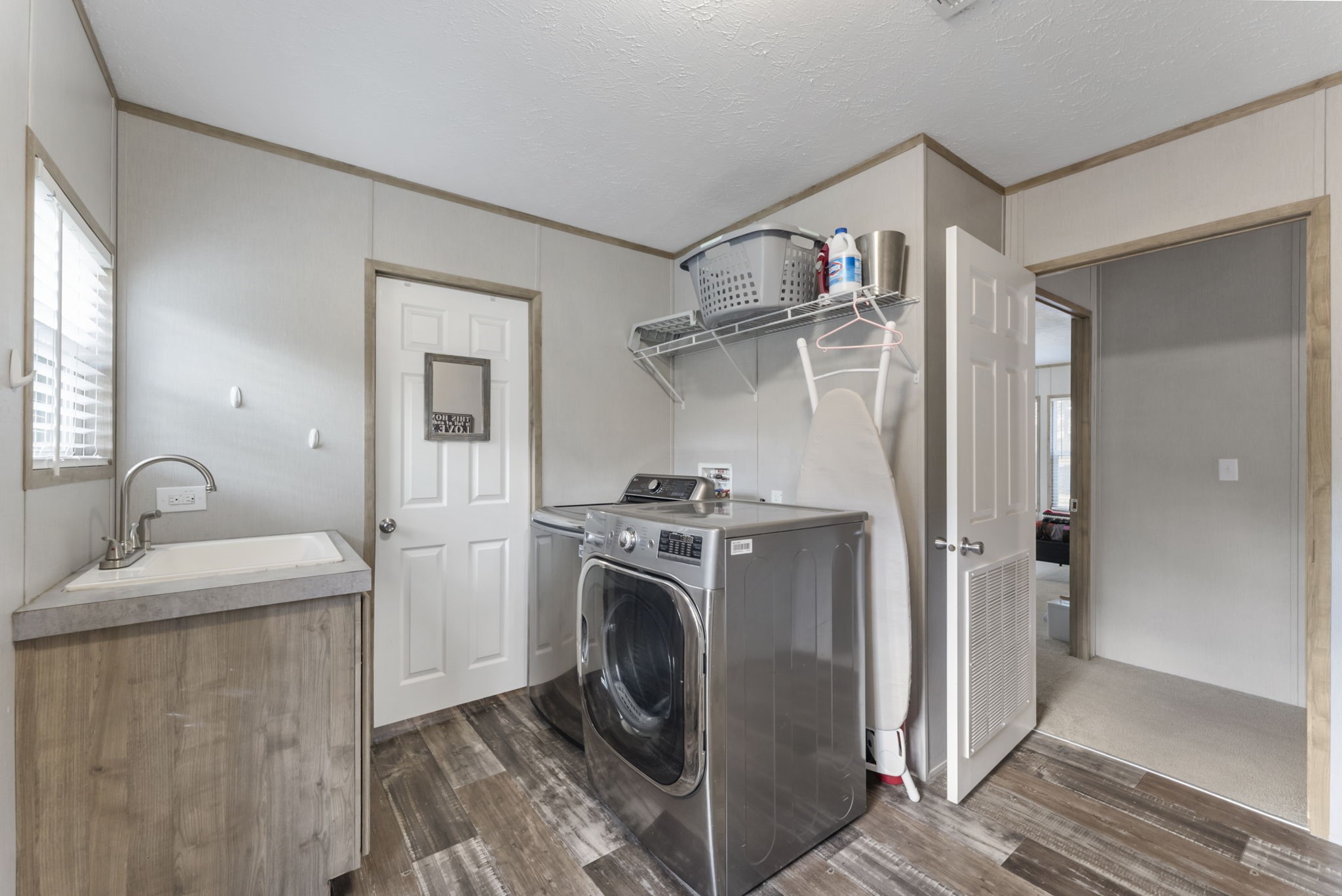 6913 Fm 3081 Road Willis, TX 77378 - Photo 25 of 46 a kitchen with stainless steel appliances granite countertop a sink a stove a refrigerator and cabinets