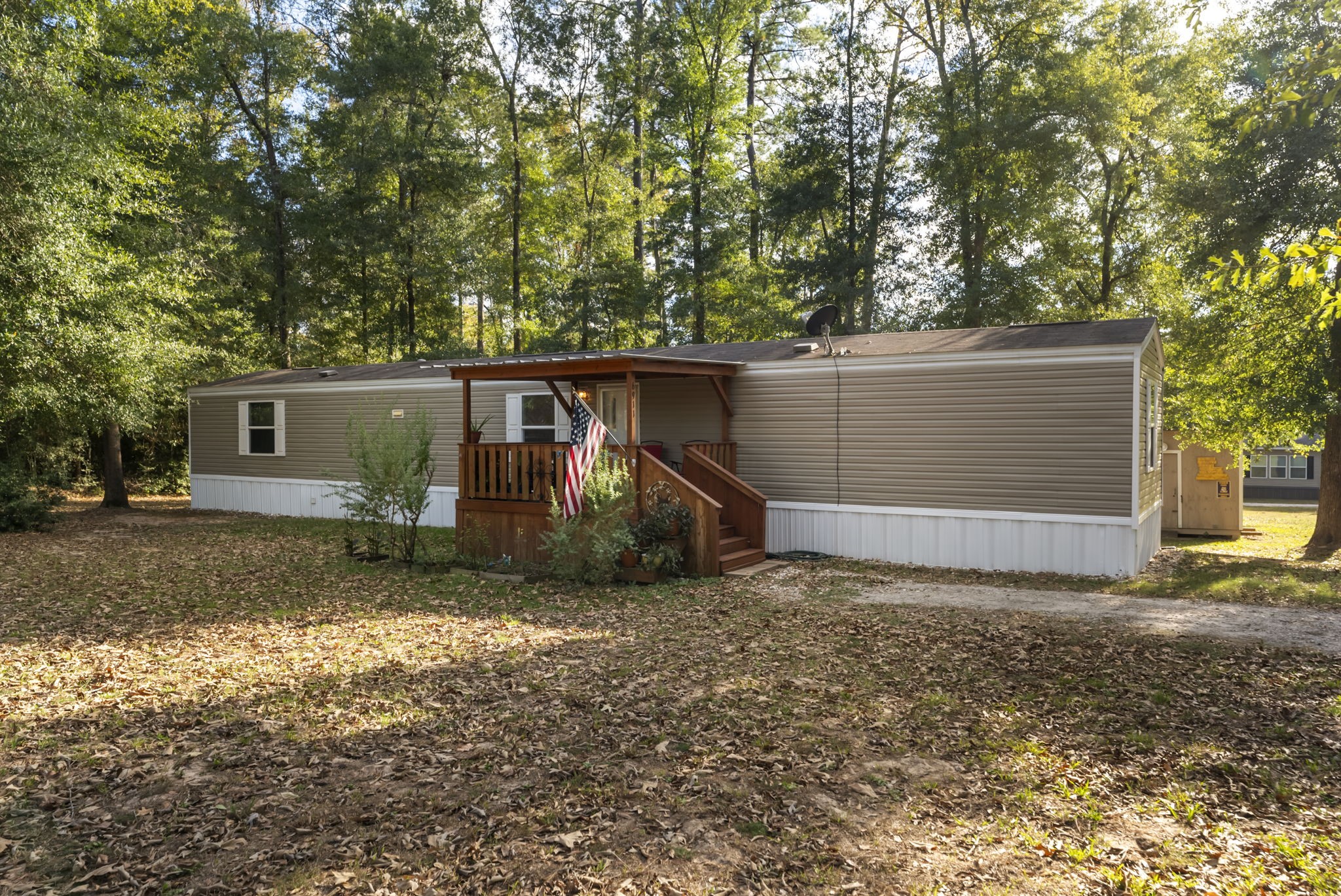 6913 Fm 3081 Road Willis, TX 77378 - Photo 29 of 46 a view of a house with backyard and trees
