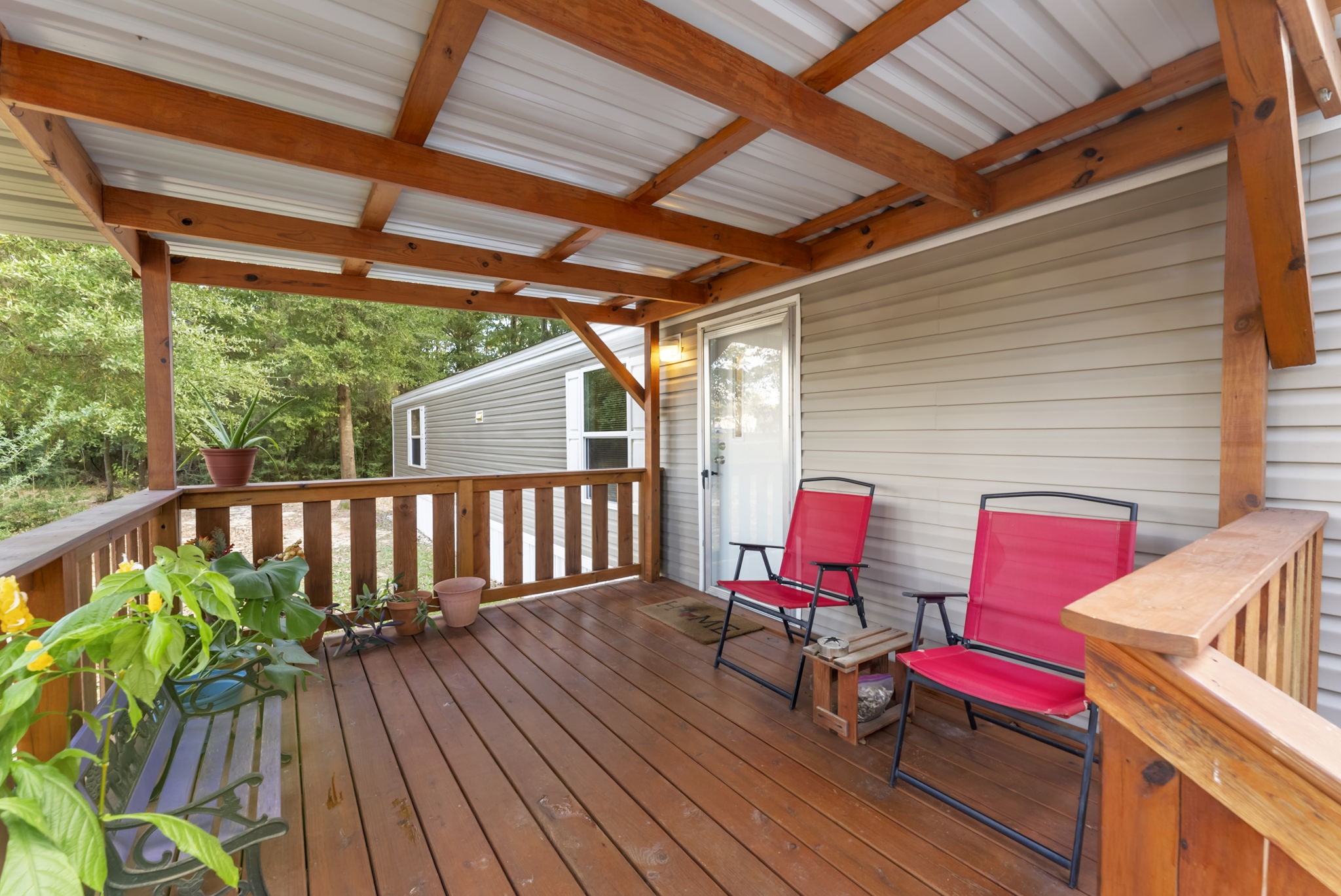 6913 Fm 3081 Road Willis, TX 77378 - Photo 30 of 46 a balcony with wooden floors and furniture