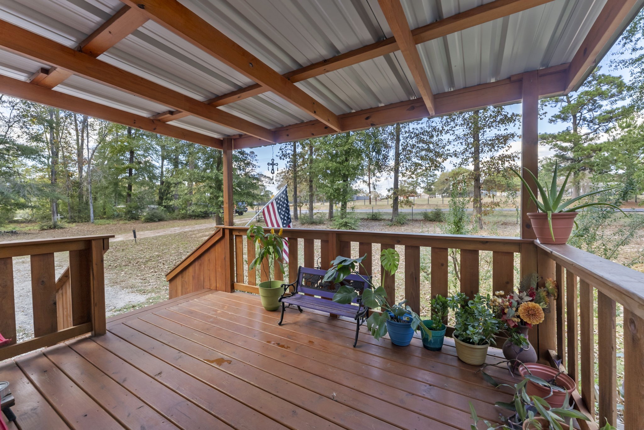 6913 Fm 3081 Road Willis, TX 77378 - Photo 31 of 46 a view of deck with wooden floor and outdoor seating