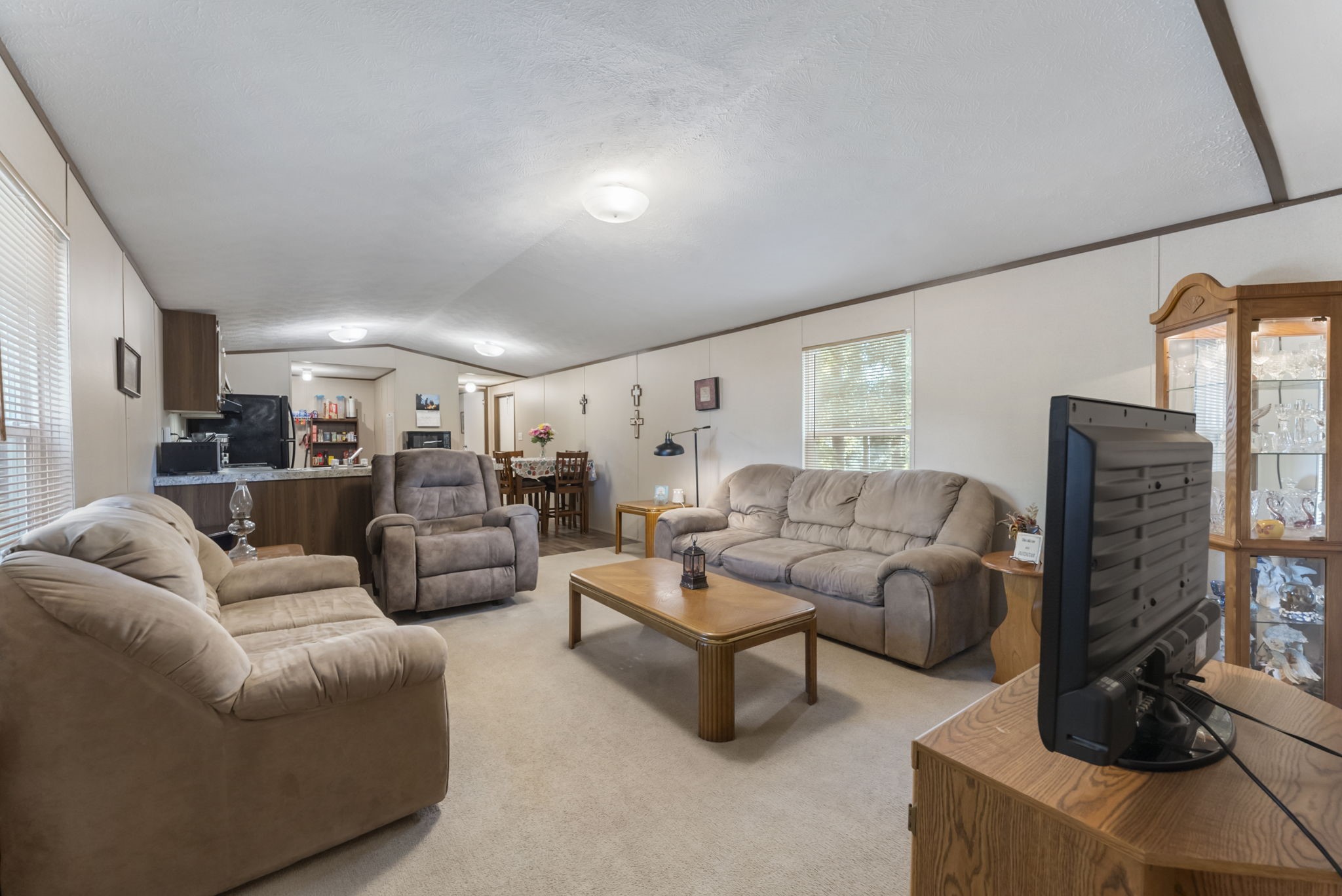 6913 Fm 3081 Road Willis, TX 77378 - Photo 46 of 46 a living room with furniture wooden floor and a flat screen tv