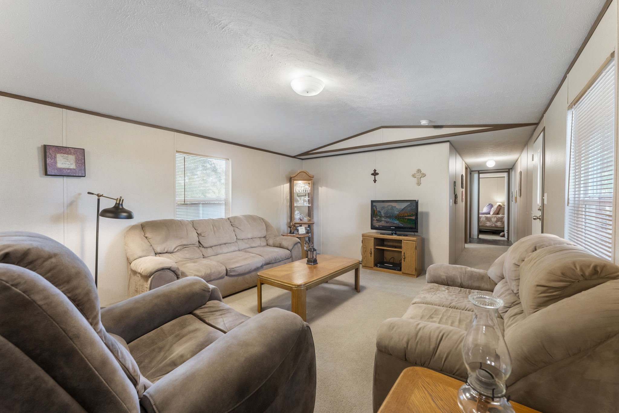 6913 Fm 3081 Road Willis, TX 77378 - Photo 33 of 46 a living room with furniture and a flat screen tv