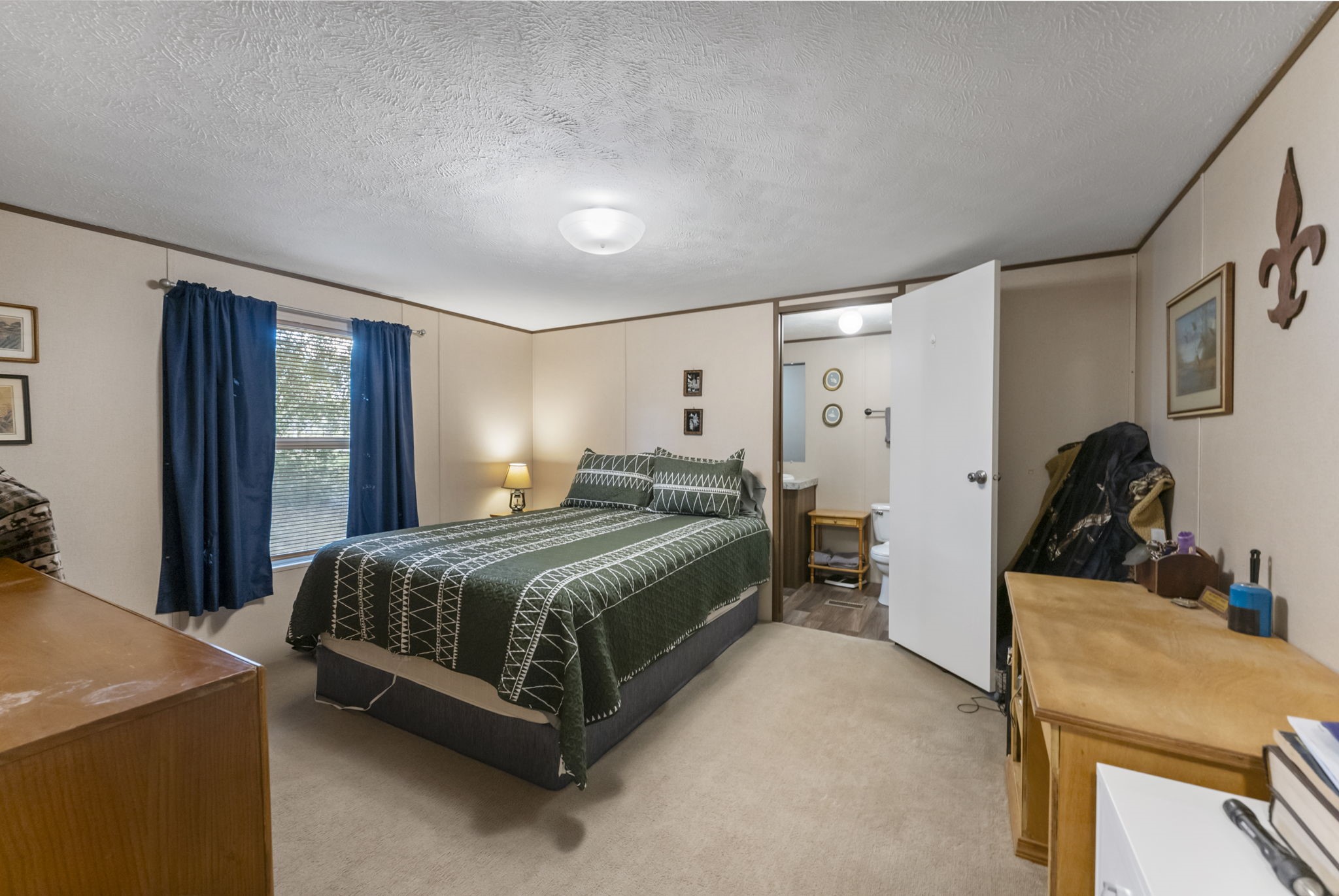 6913 Fm 3081 Road Willis, TX 77378 - Photo 38 of 46 a bedroom with a bed and a dresser