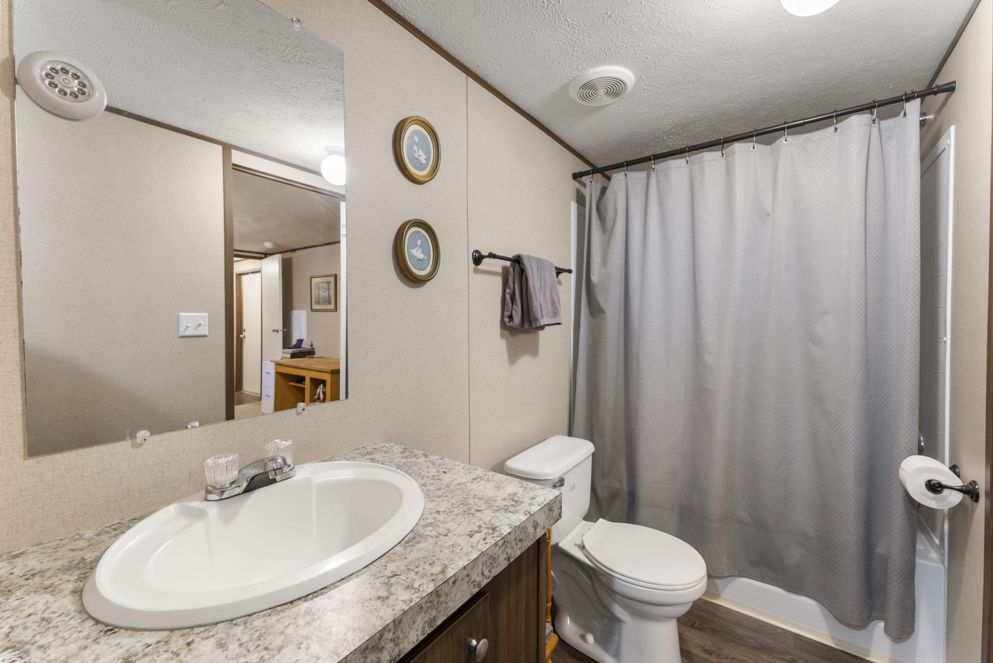 6913 Fm 3081 Road Willis, TX 77378 - Photo 39 of 46 a bathroom with a granite countertop sink toilet and a mirror