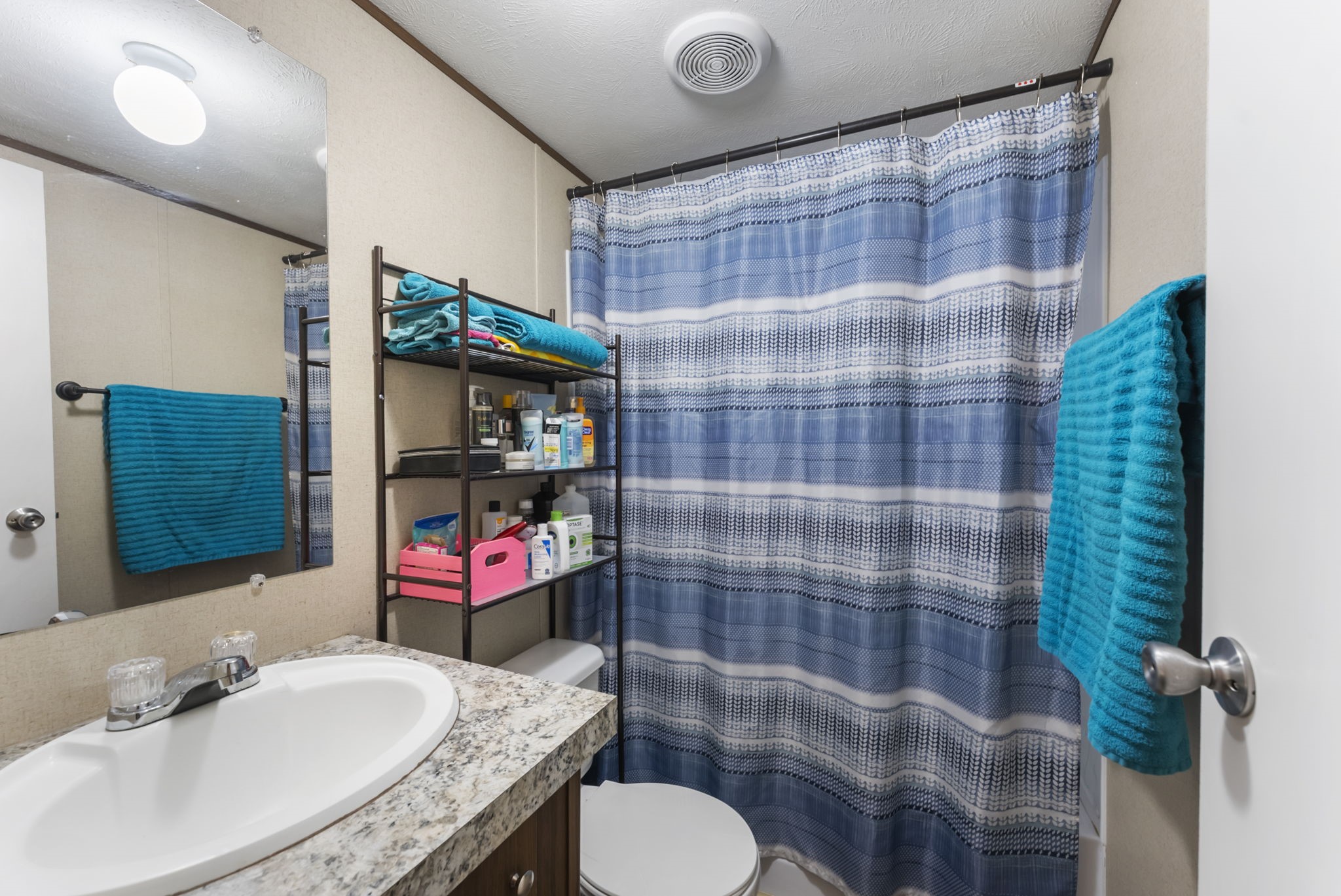 6913 Fm 3081 Road Willis, TX 77378 - Photo 40 of 46 a bathroom with a sink toilet and shower